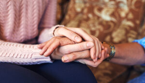 Caregiver March 2019 Hands being held