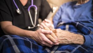 Hospice Nurse visiting an elderly male patient